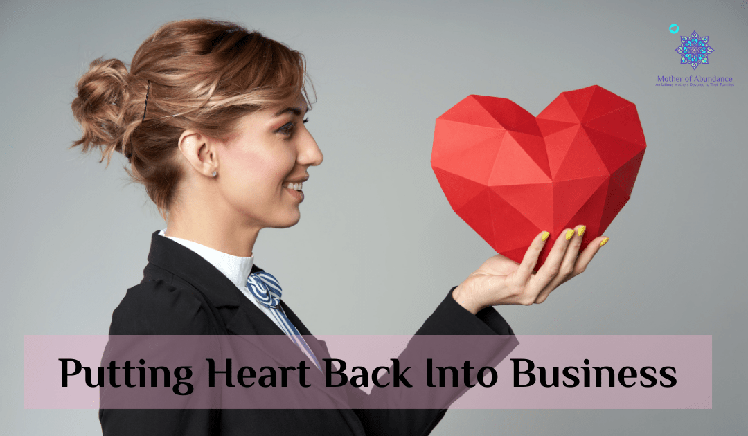 Woman in business suit holding read heart